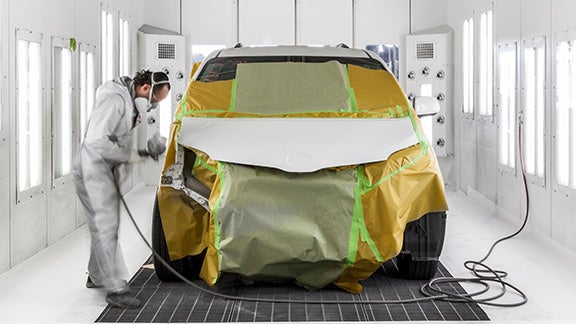 Collision Center Technician Painting a Vehicle | Bob Rohrman Toyota in Lafayette IN