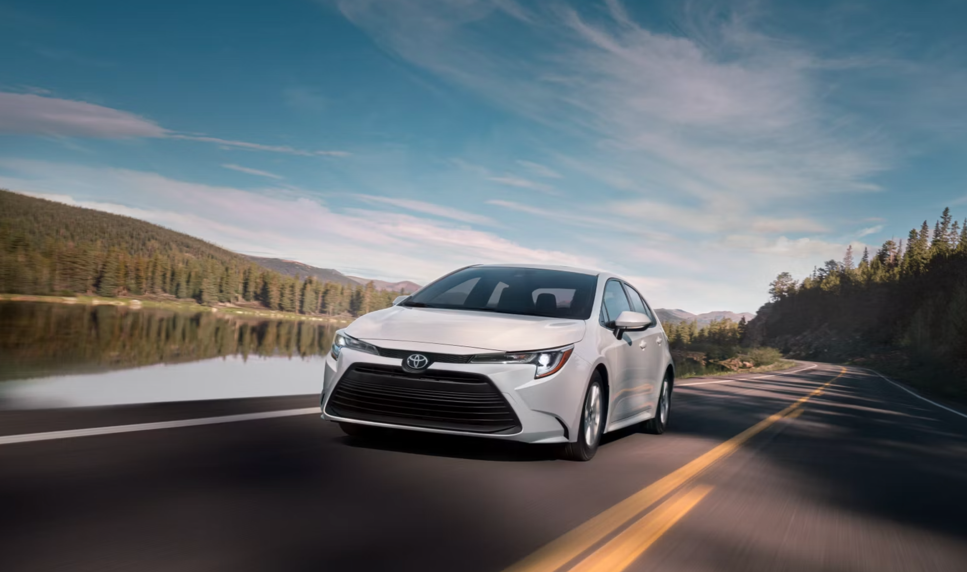 New Toyota Corolla driving through the mountain roads