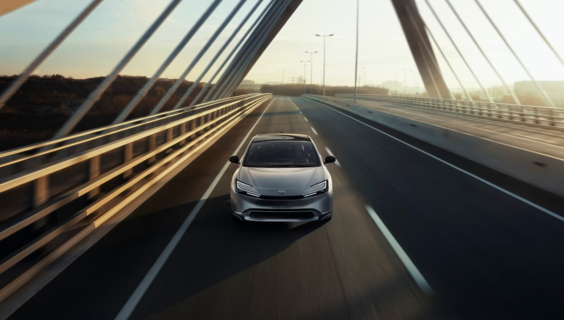 Toyota driving across a bridge