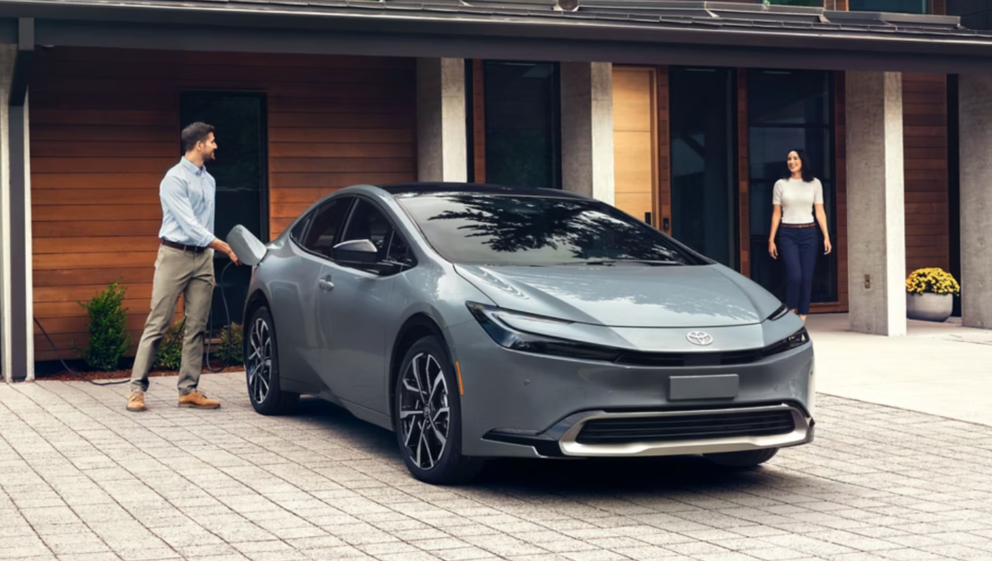 Toyota parked outside of a house on the driveway